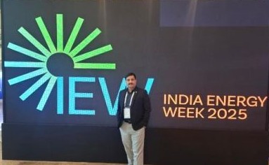 Speaker on the India Energy Week 2025 stage in front of a LED backdrop